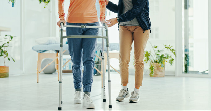 Legs, physiotherapist and walker for patient, support or help for recovery, steps or guide at hospital. Doctor, frame and person with disability for rehabilitation, balance or feet at wellness clinic