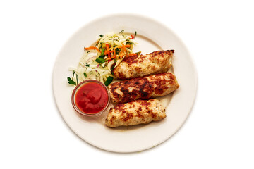 A plate of food with three pieces of meat and a side of vegetables