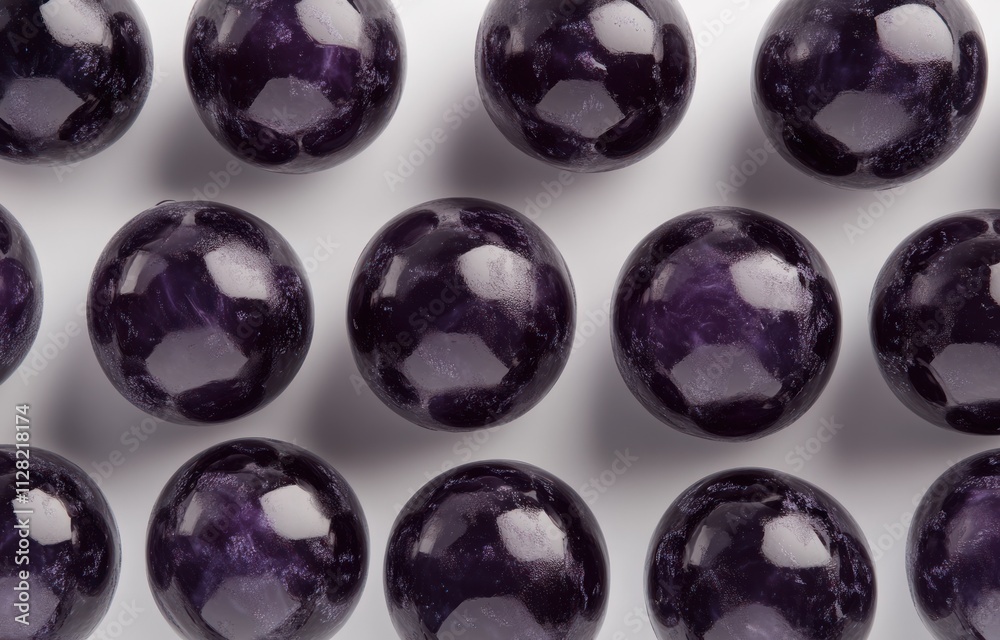 Poster A close-up view of polished purple spheres arranged in a grid pattern.