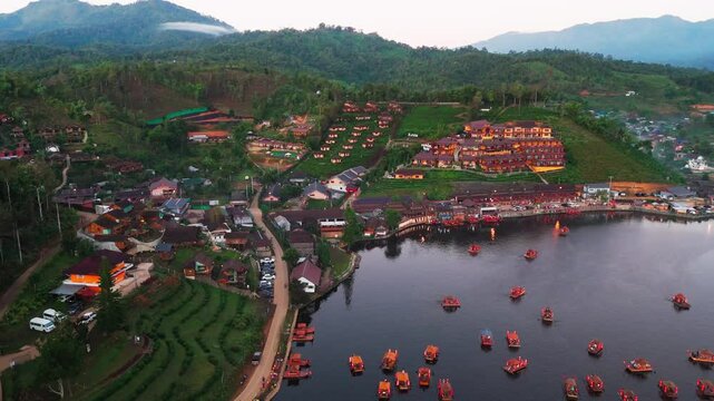 Ban Ran Thai aerial view of Chinese village on Mae Hong Son province in Northern Thailand foggy misty mountains  landscape with traditional boat on the lake 