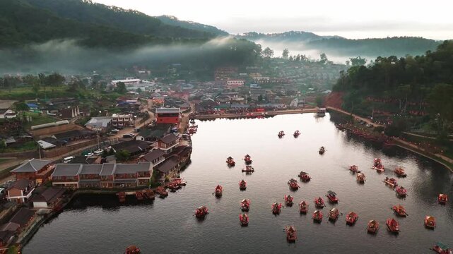 Ban Ran Thai aerial view of Chinese village on Mae Hong Son province in Northern Thailand foggy misty mountains  landscape with traditional boat on the lake 
