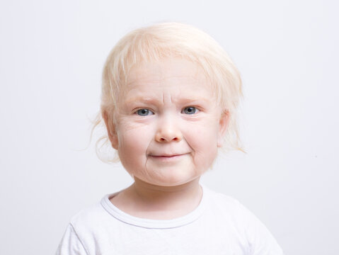 Portrait of a young boy with an artificially aged face