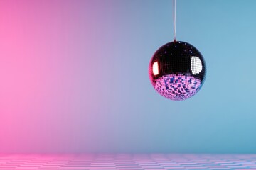 Shiny disco ball hanging over checkered dance floor with pink and blue lighting
