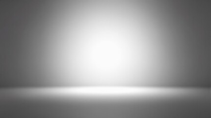 Minimalistic illuminated gray gradient background with soft spotlight effect.