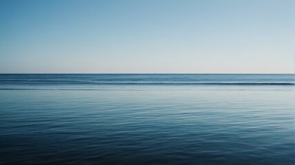 Obraz premium a person standing on the beach looking out at the ocean