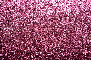 Obraz premium Close-up of glittering pink sparkles abstract shimmering texture