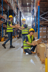 Warehouse workers working with cardboard boxes
