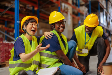 Warehouse workers on a break enjoying a friendly conversation