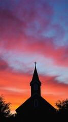 Fototapeta premium Church silhouette against vibrant sunset sky