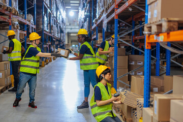 Warehouse workers organizing and moving boxes