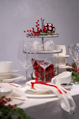 Table setting for christmas dinner with wine glasses and cutlery. Restaurant christmas decoration.