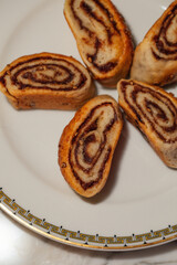 plate with five Iraqi Kleica spiral cookies made with date paste