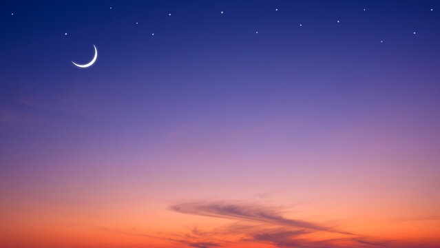 Night sky ramadan background with crescent moon and star on dramatic dark blue orange twilight sky with copy space for edit text in Mubarak holy month, Islamic new year, Eid al Adha festival