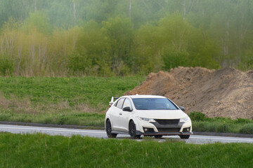 Japanese Sports Car Driving on Sunny Country Road
