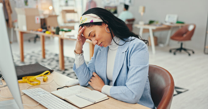 Small business, woman and tired on computer as fashion designer with headache for logistics deadline. Female person, entrepreneur and exhausted with production crisis, backlog and schedule for orders