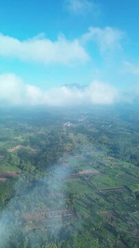 4k footage of rural atmosphere in the morning with views of mountains and rice fields and clear skies