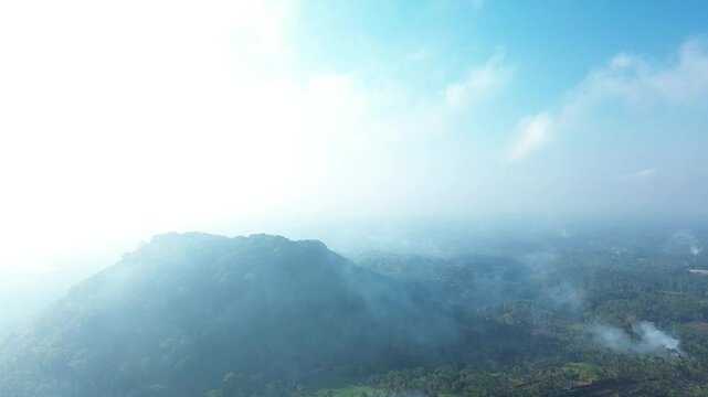 4k footage of rural atmosphere in the morning with views of mountains and rice fields and clear skies