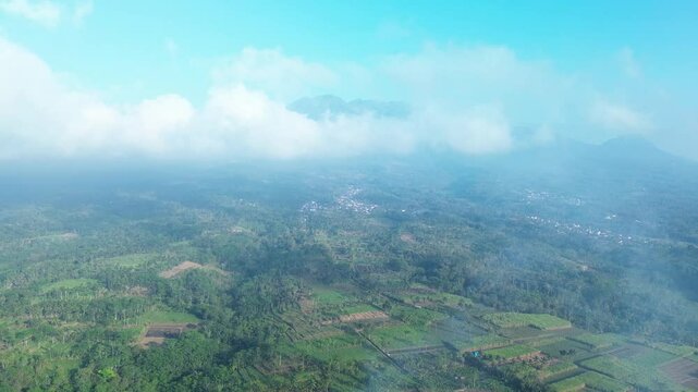 4k footage of rural atmosphere in the morning with views of mountains and rice fields and clear skies