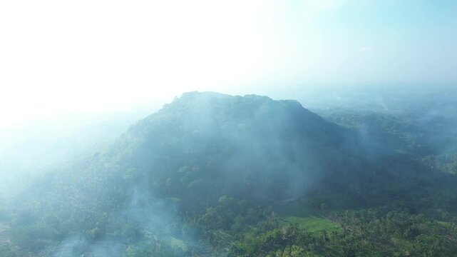 4k footage of rural atmosphere in the morning with views of mountains and rice fields and clear skies