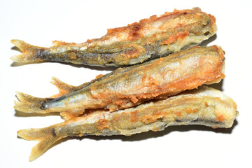 Ready-to-eat capelin fish lies on a white background.