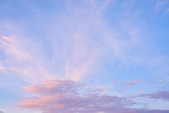 Beautiful pink clouds on blue sky in summer travel