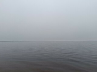 Rekyva lake during cloudy day. Cloudy day with white and gray clouds in sky. Wavy lake. Horizon over water. Rekyvos ezeras.	
