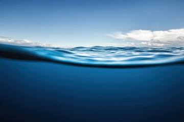 Fototapeta premium Calm ocean surface under a clear blue sky.