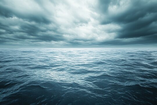 Dark, moody ocean under a cloudy sky.