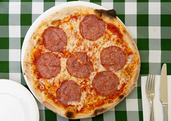 Pepperoni Pizza on Restaurant Plate, Salami Pizza with Olives, Tomatoes and Mozzarella Cheese