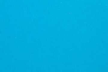 A blue background with a white line, textured origami paper backdrop