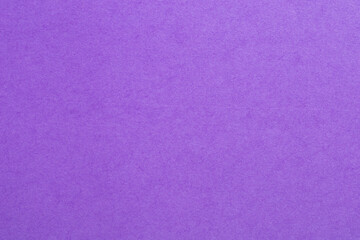 A purple background with a white and purple textured surface, textured origami paper backdrop