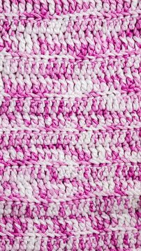 vertical video of pink knitted fabric