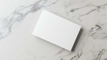 A white card is on a marble countertop