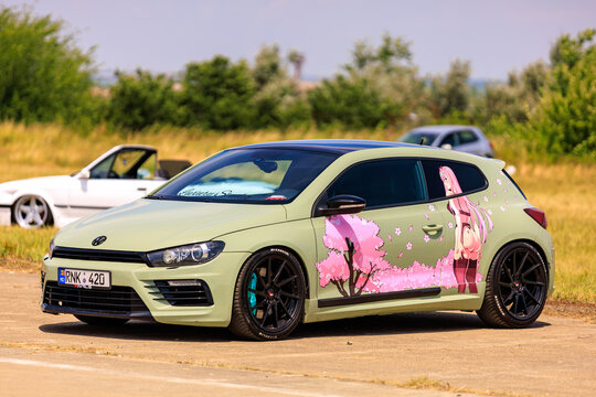 Modified Volkswagen Scirocco with custom anime artwork on the side. July 2, 2023 Liadoveni Moldova.