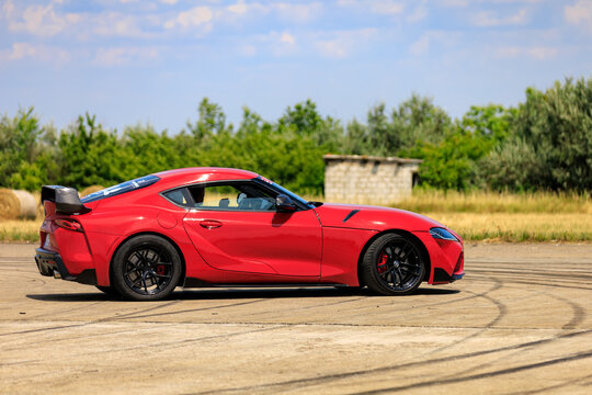 Sleek Red Toyota Supra Coupe with Black Spoiler on Track. July 2, 2023 Liadoveni Moldova.