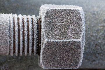 Nut and bolt covered in frozen ice crystals