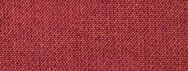 Texture dark red background from woven textile with wicker pattern, macro. Structure vintage wine fabric