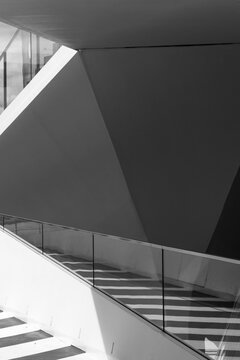 An abstract composition of geometric shapes with striking shadows, creating an intriguing visual narrative about forms and spaces in contemporary architecture and design.