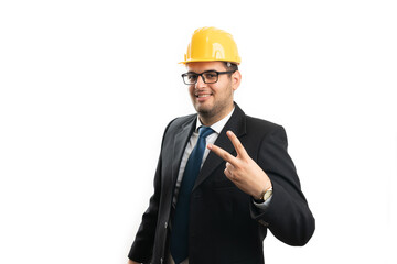 Architect man wearing hardhat showing peace or victory sign
