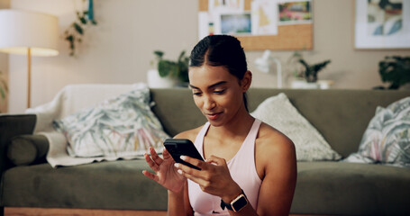 Phone, fitness and woman on internet in home for health tips, scroll message and reading sports...