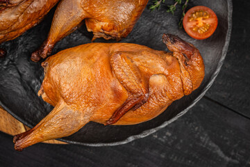 Delicious smoked quail meat on plate. top view