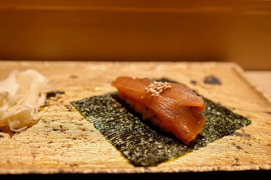 Kanpyo-maki (pickled bamboo shoot sushi roll) served with pickled ginger as part of an omakase lunch at Manten Sushi Marunouchi near Tokyo Station and the Imperial Palace - Chiyoda City, Tokyo