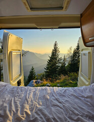 Exploring the tranquil beauty of Hallstatt, Austria from a cozy van at sunrise