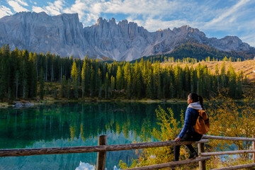 Enjoying the serene beauty of Dolomites' lakeside in Italy during a tranquil afternoon