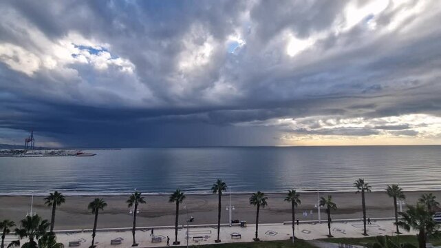4K Timelapse Hyperlapse of Storm Clouds and Sunrise Over Malaga Coastline, Spain