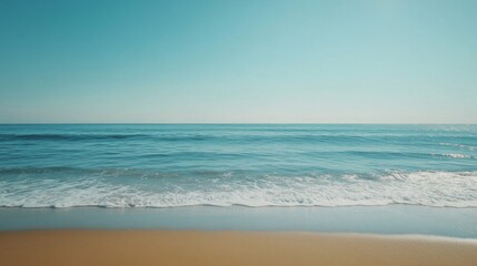 Serene Ocean Waves Rolling Onto Sandy Beach