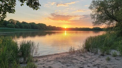 Obraz premium Serene Sunset Over Calm Lake Trees and Sky