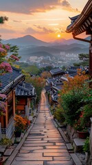 Fototapeta premium Scenic Korean Village Sunset Cobblestone Path Autumn Foliage Traditional Houses