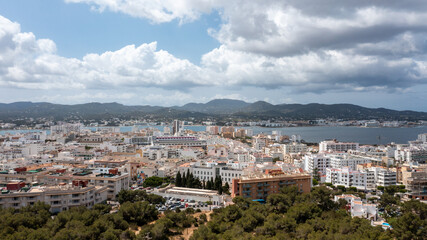 Aerial drone photo of a beach in the town of Sant Antoni de Portmany on the island of Ibiza in the Balearic Islands Spain showing the boating harbour and the beach known as Playa de San Antonio