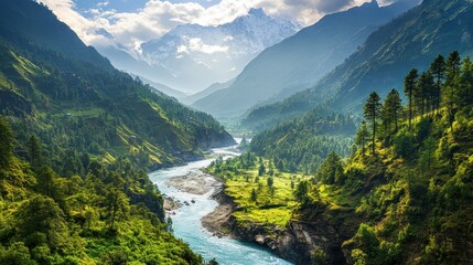Vast mountain range with river winding through the valley, lush greenery and sunlight 
